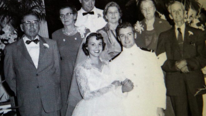 "My grandfather said I should wrap myself in the head with a hammer to grow the 1/2 inch I needed to become a pilot," said Jim Graham, on June 28, 2016. Grahams grandfather, furthest to the left, is pictured in this wedding photo taken five hours after Grahams graduation from college. 