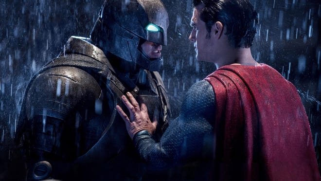 This image released by Warner Bros. Entertainment shows Ben Affleck as Batman, left, and Henry Cavill as Superman in a scene from, "Batman V. Superman: Dawn Of Justice." (Clay Enos/Warner Bros. Entertainment via AP)