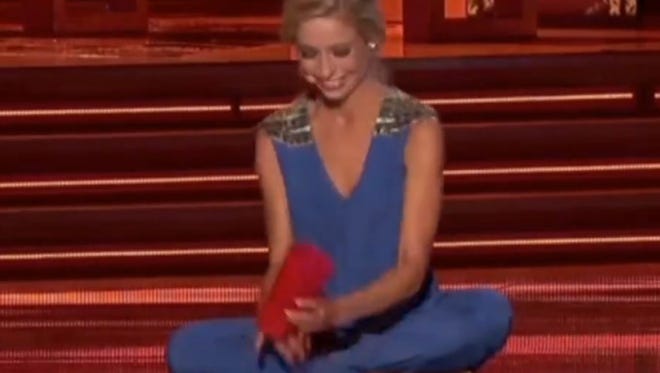Miss New York sings "Happy" while tapping a red cup on the stage at the Miss America Pageant.