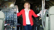 Debbie Travis King stands in the cockpit of CAF’s B-29 FIFI.