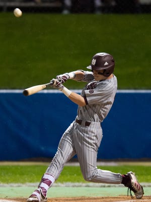 Mississippi State's Jake Mangum (15) puts a ball into play against Jackson State during their game Wednesday night in Jackson.