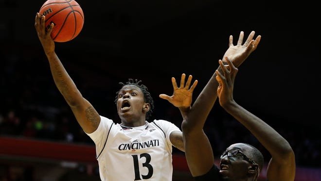 Cincinnati Bearcats forward Tre Scott (13) goes up for the layup in the first half.