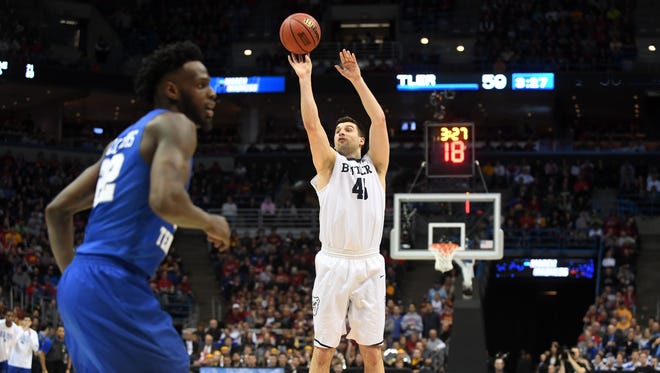 Butler Bulldogs forward Andrew Chrabascz (45)  shoots a three point shot during the second half of the game against the Middle Tennessee Blue Raiders in the second round of the 2017 NCAA Tournament at BMO Harris Bradley Center.