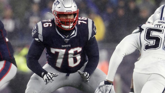 New England Patriots offensive tackle Isaiah Wynn blocks during a game against the Dallas Cowboys at Gillette Stadium Nov. 24, 2019, in Foxborough.