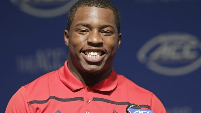 Louisville's James Burgess responds to questions during the ACC NCAA college football kickoff in Pinehurst, N.C., Monday, July 20, 2015. (AP Photo/Gerry Broome)