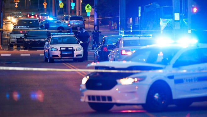 Metro Nashville Police officers work the scene of a shooting near Jo Johnston and 17th Avenue North Thursday, July 26, 2018, in Nashville, Tenn. 