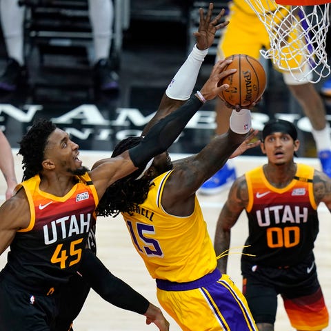 Utah Jazz guard Donovan Mitchell (45) blocks a sho