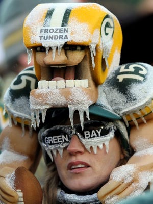 Green Bay Packers Fans attend the NFC Divisional playoff game between the Green Bay Packers and the New York Giants at Lambeau Field on January 15, 2012 in Green Bay, Wisconsin.