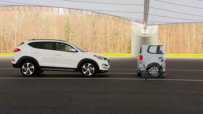 In this frame grab from video provided by the Insurance Institute for Highway Safety (IIHS), taken in 2015, a vehicle closes in on a Strikeable Surrogate Vehicle (SSV) at the IIHS Vehicle Research Center in Ruckersville, Va. Federal regulators and the auto industry are taking a more lenient approach than safety advocates would like to phasing in automatic braking systems for passenger cars, according to the official records of their closed-door negotiations. Systems that automatically apply brakes to prevent or mitigate collisions, rather than waiting for the driver to act, are the most important safety technology available today thats not already required in cars. (Insurance Institute for Highway Safety via AP)