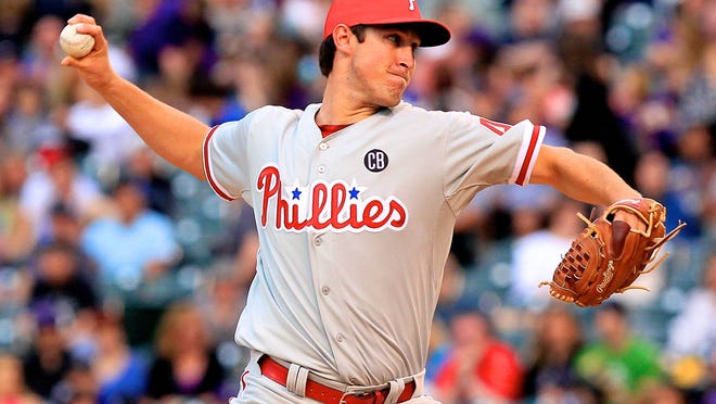 
Phillies starting pitcher Jonathan Pettibone (44) pitches in the first inning Friday against the Colorado Rockies at Coors Field. 
