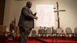 Daryl Parks, an attorney for the Brown family, sets up an autopsy diagram before the start of a news conference at the Greater St. Marks Family Church in Ferguson.
