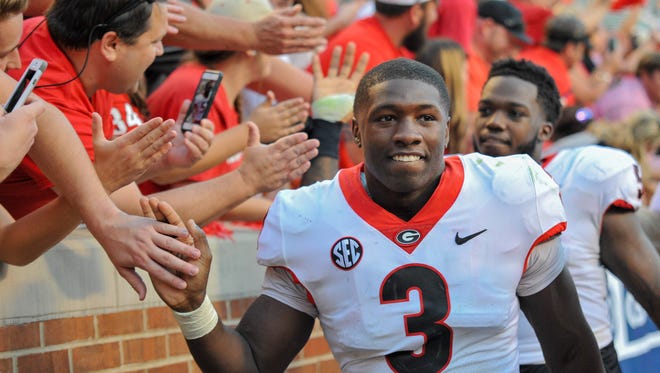 Sep 30, 2017; Knoxville, TN, USA; Georgia Bulldogs linebacker Roquan Smith (3) celebrates with fans after the game at Neyland Stadium. Georgia won 41 to 0.
