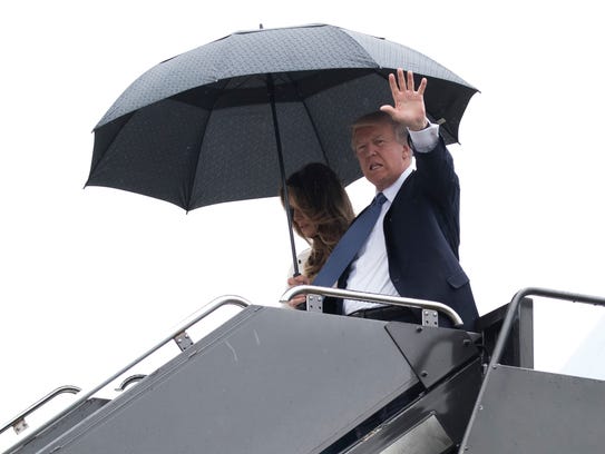 President Donald Trump, accompanied by first lady Melania
