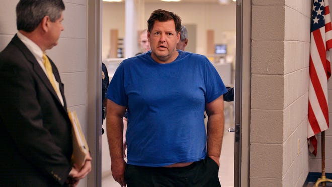 Todd Kohlhepp is escorted into a Spartanburg County magistrate courtroom, Friday, Nov. 4, 2016, in Spartanburg, S.C.. Kohlhepp, a 45-year-old registered sex offender with a previous kidnapping conviction, appeared at a bond hearing Friday on a kidnapping charge in connection to a woman being found chained inside a storage container on a property in Woodruff, S.C. More charges will be filed later, the prosecutor told the court.