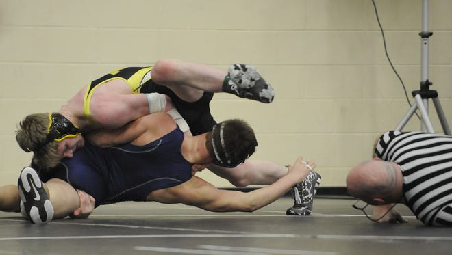 Watkins Memorial's Max Boyd wrestles during the 2015 Division I district meet. He likely will be competing at 182 pounds this season.