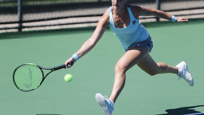 Jamie Loeb sprints to hit a shot against Ingrid Neel on Wednesday at the Hunt Communities $25,000 Women's Pro Tennis Classic at Tennis West Sports & Racquet Club. Loeb won and advanced.