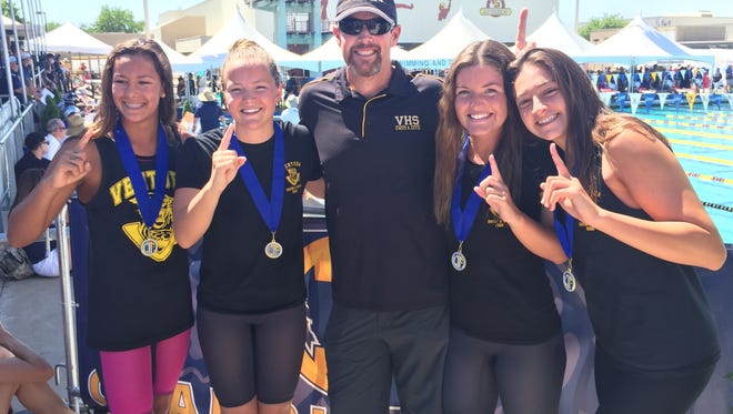 The Ventura High 200 girls individual medley relay team set a state meet record by finishing first in 1:41.76 on Saturday at Clovis High. Pictured (left to right): Téa Laughlin, Alicia Harrison, coach Mark Schmidt, Lindsay Clark and Amelia Ayala.