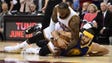 JaVale McGee and LeBron James go for a loose ball during