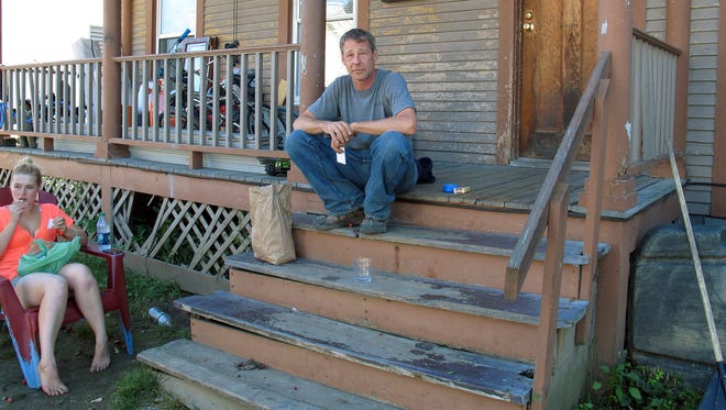 In this Sept. 15 photo, Tom VanEps sits on the steps of his home in Rutland. Echoing comments by city officials, VanEps said he has seen progress in the city's much publicized problem with heroin and other opiate drugs.