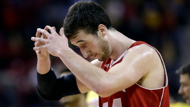 Wisconsin forward Frank Kaminsky reacts during the final moments of Tuesday night's loss to Maryland, in College Park, Md. It was that kind of night for the Badgers.