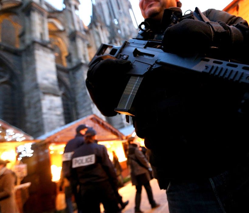 French police officers patrol at the Christmas market in Reims, France, on Dec. 20.