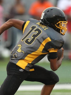 With “Harvel” on the back of his jersey, King’s Ambry Thomas runs for a TD.