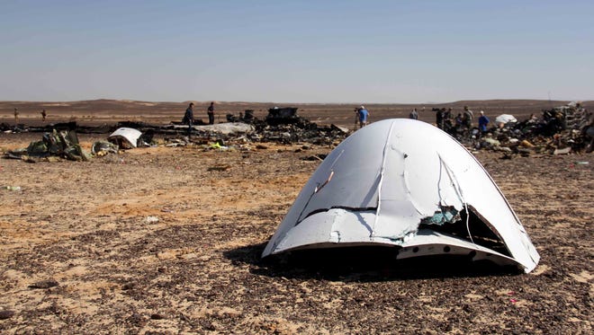 Debris of a Russian airplane is seen, November 1, 2015, a day after the passenger jet bound for St. Petersburg, Russia, crashed in Hassana, Egypt. The Metrojet plane crashed 23 minutes after it took off from Egypt's Red Sea resort of Sharm el-Sheikh. 224 people on board, all Russian except for four Ukrainians and one Belarusian, died.