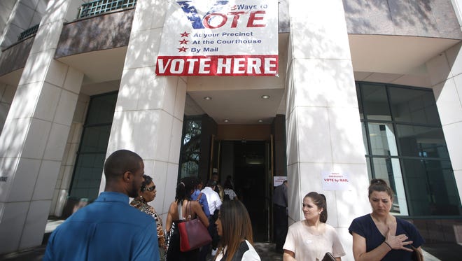People wait in line to vote at the Leon County Courthouse during Florida's primary election March 15.
