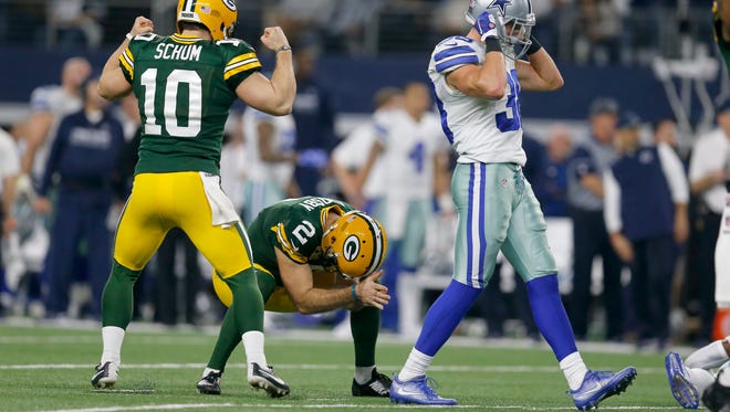 Packers kicker Mason Crosby (2) reacts after kicking the winning field goal as punter Jacob Schum (10) celebrates at the end of a 34-31 divisional playoff game win over the Cowboys on Jan. 15, 2017, at AT&T Stadium in Arlington, Texas.