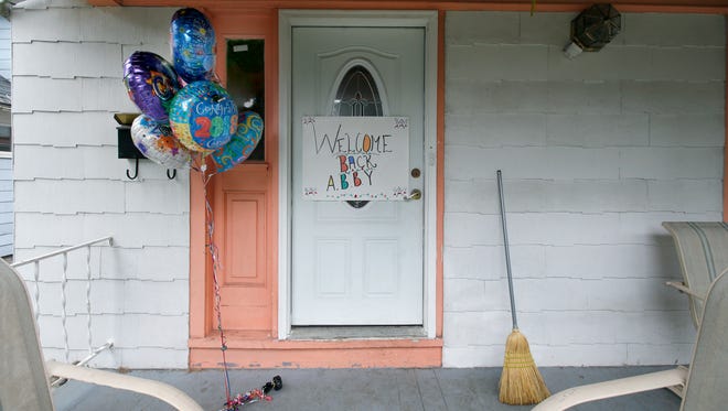A welcome sign graces the front door at the northeast Rochester home of Abigail Hernandez. She never got to see it. Hernandez, an undocumented immigrant who was accused of making a terroristic threat at East High School, was taken into custody Wednesday by Immigration and Customs Enforcement officials.