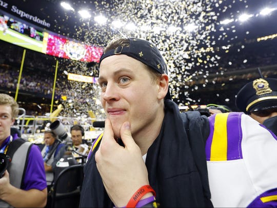 NEW ORLEANS, LOUISIANA - JANUARY 13: Joe Burrow #9 of the LSU Tigers celebrates after defeating the Clemson Tigers 42-25 in the College Football Playoff National Championship game at Mercedes Benz Superdome on January 13, 2020 in New Orleans, Louisiana. (Photo by Kevin C. Cox/Getty Images) ORG XMIT: 775440661 ORIG FILE ID: 1199370746