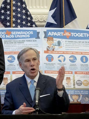 Gov. Greg Abbott, flanked by Lt. Gov. Dan Patrick, left, and House Speaker Dennis Bonnen, speaks during a press conference at the Capitol about the Texas&rsquo; response to the coronavirus in late March. The trio on Wednesday told state agency heads to come up with 5% budget cuts for the current budget cycle.