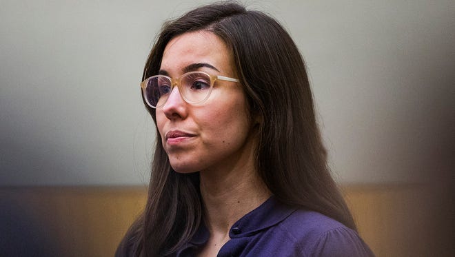 Jodi Arias looks toward the jury entering the courtroom during the sentencing phase retrial Tuesday, March 3, 2015. The judge in the case ordered Arias on Monday, June 22, 2015, to pay more than $32,000 to the family of Travis Alexander, the man she was convicted of killing.