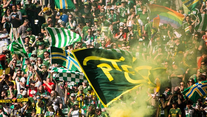 Portland Timbers fans celebrate after goal during the second half against New York City at Providence Park. The Timbers won 3-0.