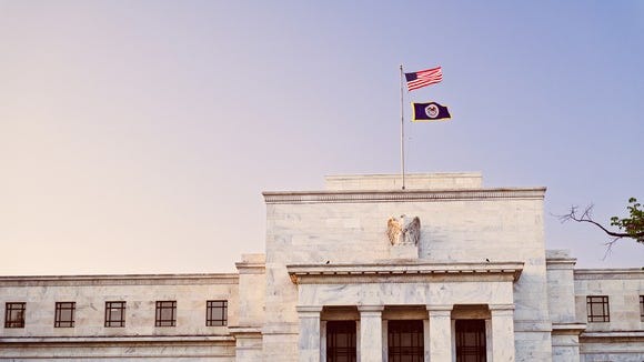 The U.S. Federal Reserve Building at sunset.