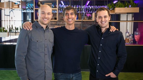 Lyft co-founders Logan Green (left) and John Zimmer (right) with CapitalG partner David Lawlee (center). Alphabet's CapitalG fund is leading a $1 billion investment round in the ride-hailing company. Lawlee will join Lyft's board of directors.