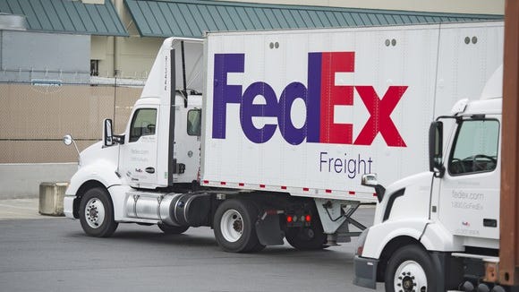 A FedEx truck preparing to head out on the open road.