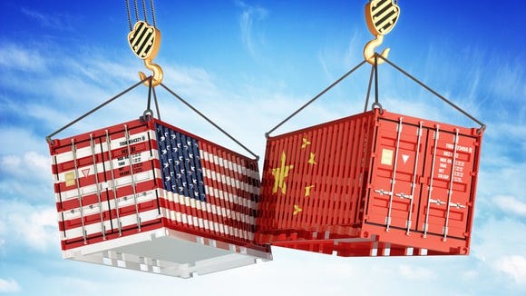 A cargo container painted with a U.S. flag colliding with a cargo container painted with a China flag