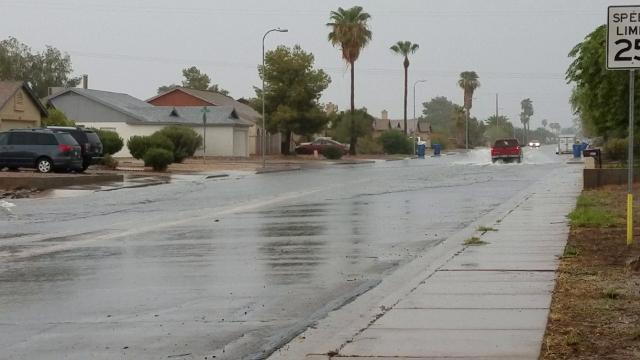 Rain and rushing water in east Mesa