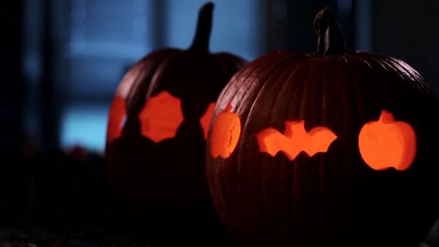 Use a cookie cutter to carve a pumpkin