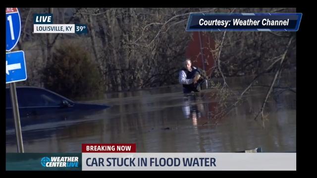 Weather Channel meteorologist helps man who drove into high water near River Road