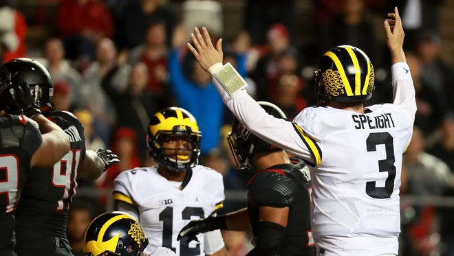 Wilton Speight of the Michigan Wolverines signals a touchdown during the first half against the Rutgers Scarlet Knights.