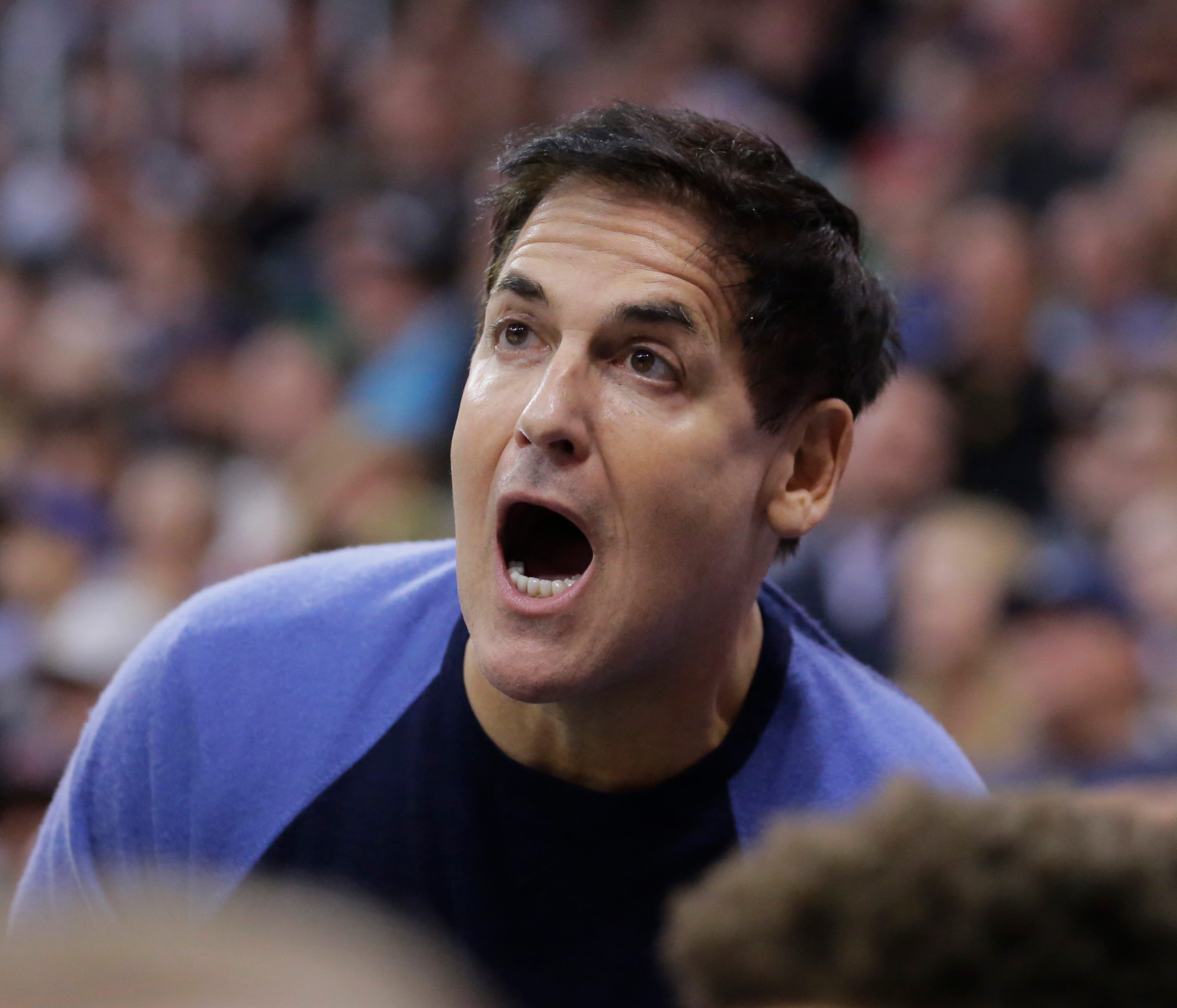 FILE - In this Dec. 16, 2016 file photo, Dallas Mavericks owner Mark Cuban shouts to his team in the first half during an NBA basketball game against the Utah Jazz  in Salt Lake City.  Cuban questioned the effectiveness of President Donald Trump's ex