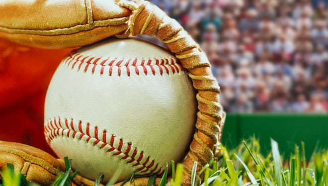 A low angle close-up of a new baseball sitting in a brown leather baseball glove that is lying in the grass with a stadium full of spectators in the background with any over all grainy look.