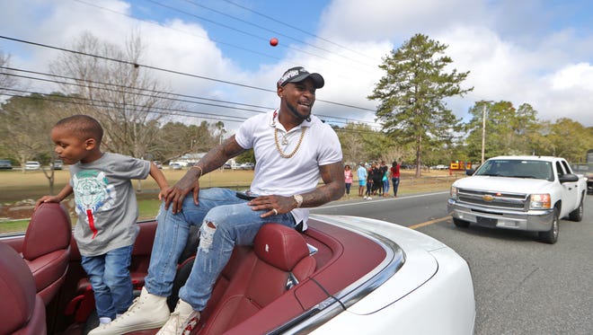 Philadelphia Eagles' linebacker Nigel Bradham, with his son Nazir, 3, returns home to Crawfordville as a Super Bowl champion, playing the part of Grand Marshall in a parade at this year’s Wakulla County Christian Coalition’s Black History Festival. Bradham played football locally at Florida State and Wakulla High School.