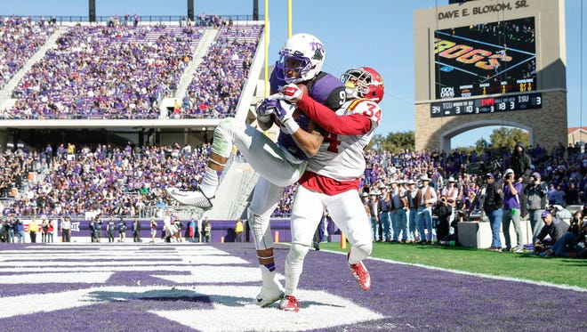 TCU Horned Frogs wide receiver Josh Doctson (9) catches a touchdown pass over Iowa State Cyclones defensive back Nigel Tribune (34) during the third quarter