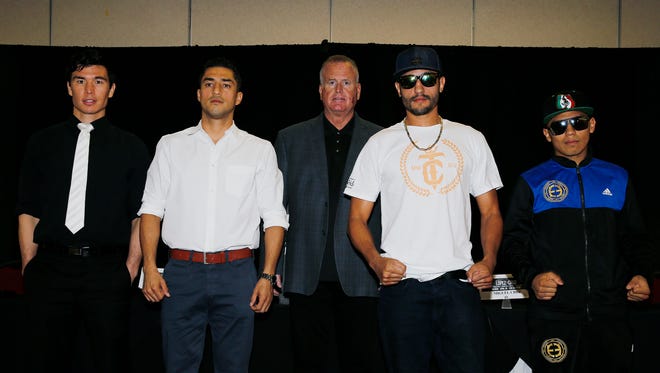 El Pasoan Abraham “Abie” Han, Josesito Lopez, Miguel Cruz and Jorge Lara all pose together for a picture at the end of the press conference announcing the upcoming fight card which will be held at the Don Haskins Center April 28. This is the second fight card that Premier Boxing Champions will bring to El Paso this year. Han will fight former world champion Anthony Dirrell in a 168 pound fight in the co-main event while Lopez and Cruz will be the featured fight of the night which will be televised on FOX and FOX Deportes nationally. Tom Brown, promoter of the fight card stands in the middle of the fighters.