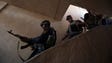 Iraqi forces walks down a staircase as they advance