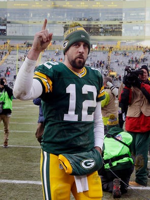 Aaron Rodgers acknowledges fans after the Green Bay