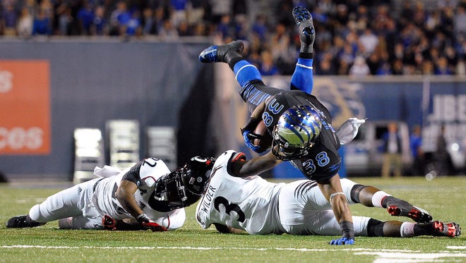 Memphis' Brandon Hayes carries the ball against the Bearcats during last year's game at the Liberty Bowl.